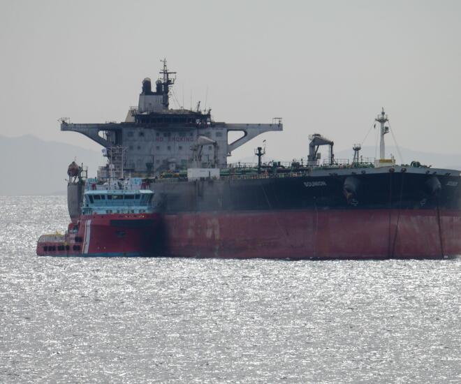 Piraeus, Greece, 17 March 2025. The Greek tanker "Sounio" is seen towed by two tugs in order to keep position in Piraeus anchorage. The tanker Sounion which drew worldwide attention in August 2024 after it was damaged by the Houthis in multiple attacks of
