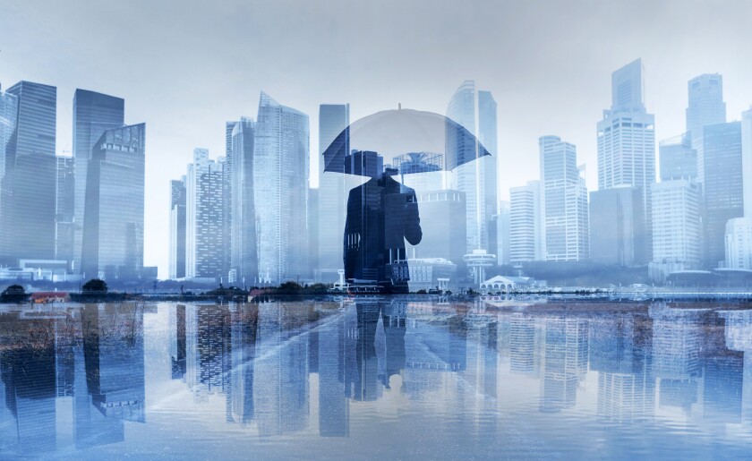 insurance concept, risk in business, businessman with umbrella