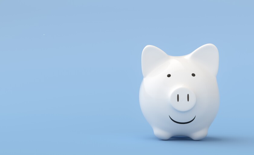 Piggy bank on blue background.jpg