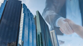 handshake office deal acquisition