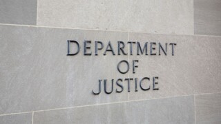 Department of Justice sign on wall.jpg