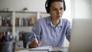 Mature woman working from home during COVID-19 pandemic