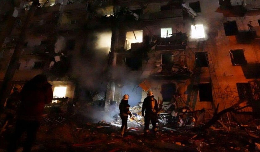 Kiev, Ukraine. 24th Feb, 2022. Ukrainian firefighters respond to the a rocket attack on a residential building attacked by Russian military forces during the invasion February 25, 2022 near Kiev, Ukraine. Credit: State Emergency Service of Ukraine/State E