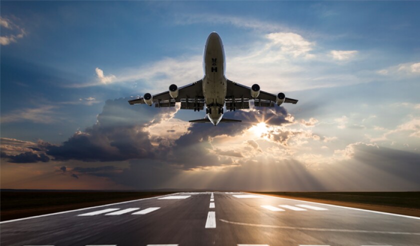 passenger-airplane-taking-off-at-sunset.jpg