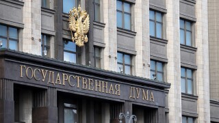 Facade of Russian Parliament building in Moscow with emblem of Russia.jpg