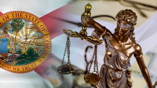 Figure Justice holding the scales of justice with lawyer working on documents