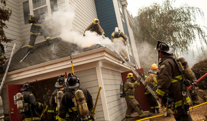firefighters-work-to-extinguish-a-corner-of-the-paradise-best-western-hotel-off-clark-road-in-paradise-california-the-camp-firepa-39691997-web.jpg
