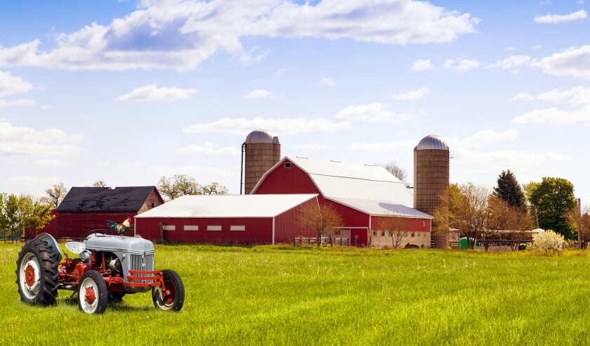 Traditional american red farm with tractor