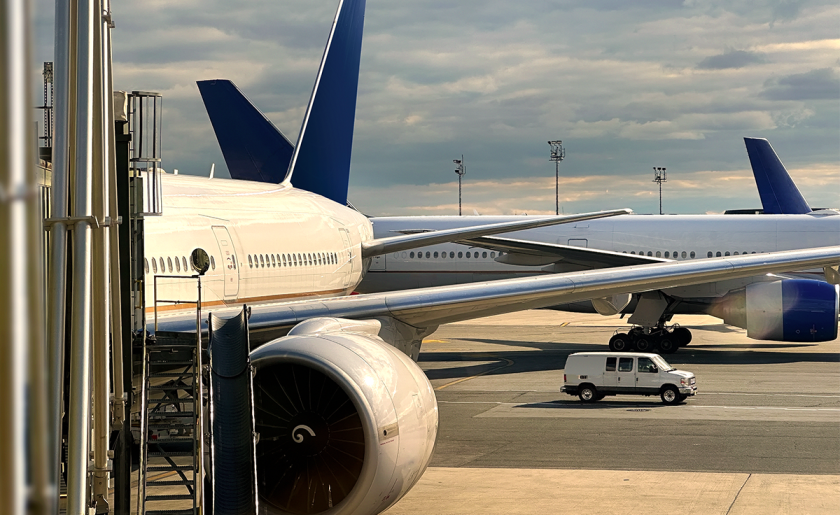 commercial airplane at gate airport aerospace aviation.png