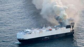 In this photo provided by the U.S. Coast Guard, smoke rises from cargo vessel Morning Midas approximately 300 miles south of Adak, Alaska, June 3, 2025, as the crew of a cargo ship carrying around 3,000 vehicles to Mexico, abandoned ship after they could