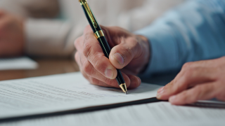 sign contract agreement GETTY 2024.png