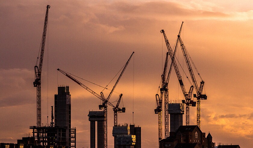 Cranes and construction equipment on London city skyline.jpg