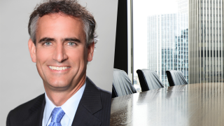 mo tooker headshot boardroom 2025.png