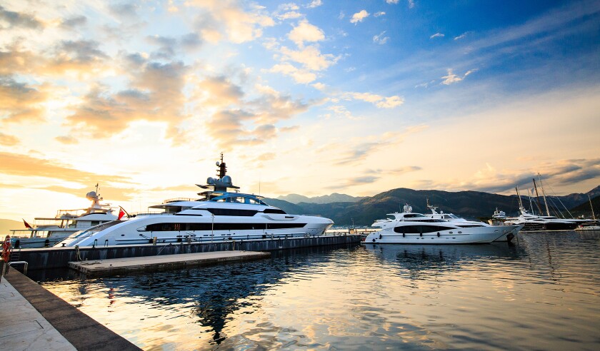 Luxury yacht marina. Port in Mediterranean sea at sunset. Modern superyacht boat, side view.jpg
