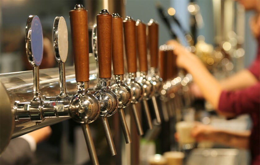 metal taps with the wooden handle for draft beer .jpg