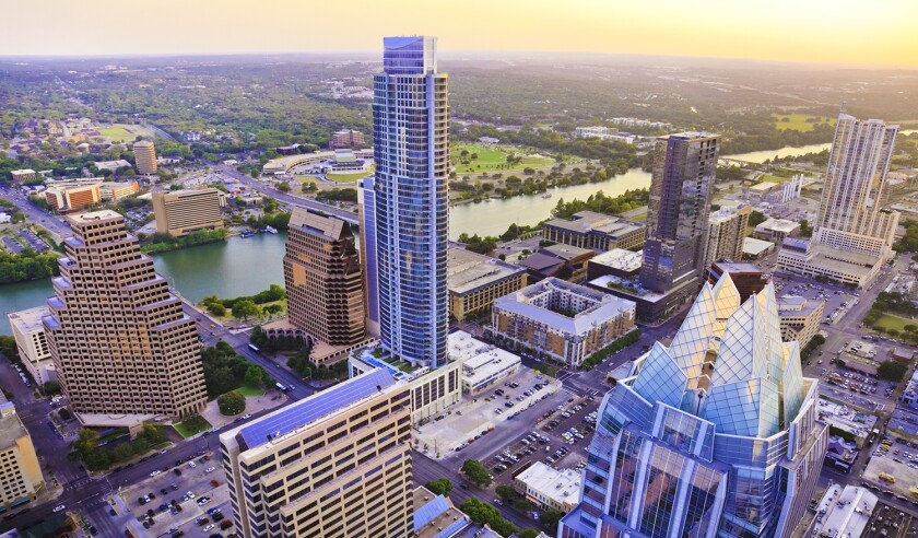 Austin Texas skyscrapers skyline aerial at sunset from helicopter