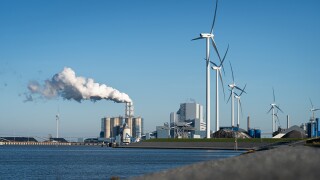Fossil fuel (coal) power station and wind turbines in the Eemshaven generating power.jpg