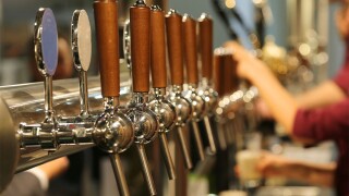 metal taps with the wooden handle for draft beer .jpg