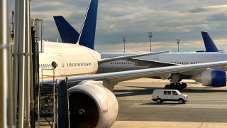 commercial airplane at gate airport aerospace aviation.png