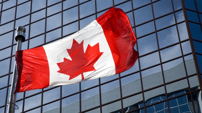 Canadian flag in front of building.jpg