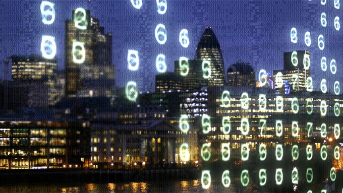 Financial district London w code London office blocks and the Thames overlaid with binary code and glowing numbers.jpg