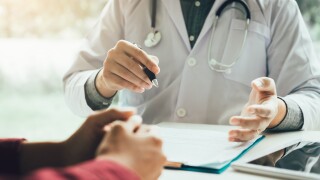 Doctor talking to the patient about menopause and treatment in future.