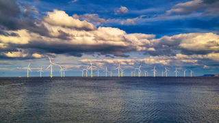 Offshore wind turbines off coast renewable energy esg.png