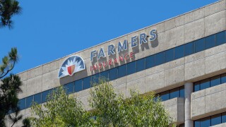 Farmers Insurance logo aon their headquarters building in Woodland Hills, CA, USA.