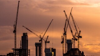Cranes and construction equipment on London city skyline.jpg