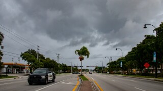 Street view before Hurricane Dorian in Deerfield Beach, FL. Dramatic clouds before Hurricane. Peoples against the weather.