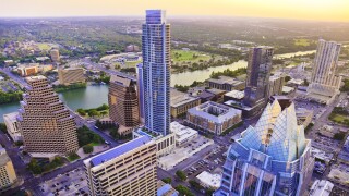 Austin Texas skyscrapers skyline aerial at sunset from helicopter