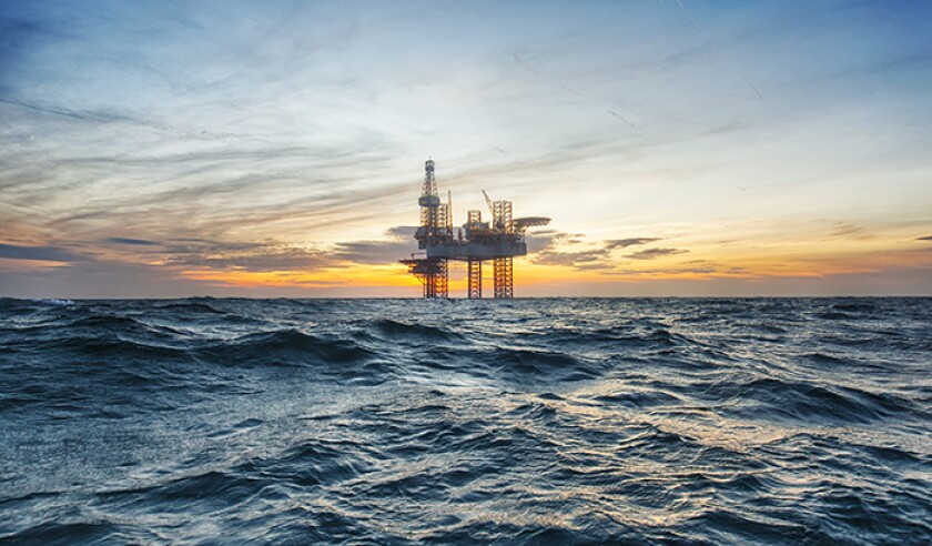 Offshore drilling rig at sunset