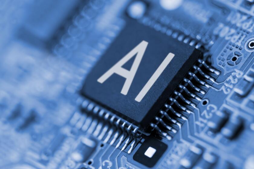 Close- up of computer chip with AI sign. Artificial intelligence.
