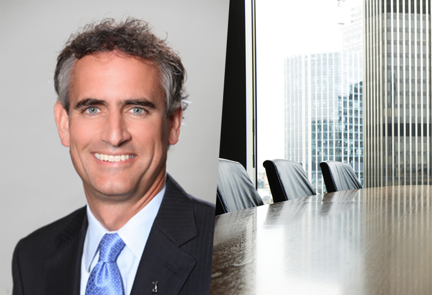 mo tooker headshot boardroom 2025.png