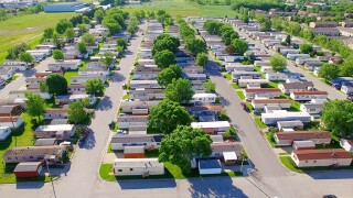 Vast trailer park, mobile home court on sunny summer morning.