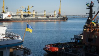 Ukrainian flag flies from the stern of a ship in the Black Sea port of Odessa, Ukraine.jpg