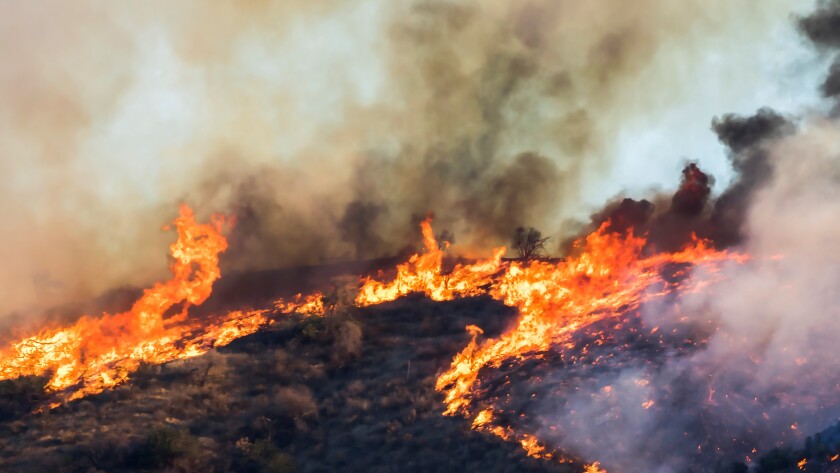 Woolsey Wildfire Burns on Hillside with Flames and Smoke in California Woolsey Fire