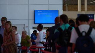 New York, New York, USA. 19th July, 2024. A screen at JFK Airport Terminal 1 displays a blue recovery mode message after a faulty Microsoft update by the cybersecurity company, Crowdstrike led to widespread computer outages, grounding numerous flights. (C
