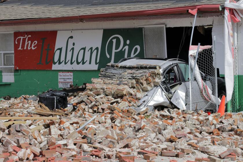 New Orleans, United States. 30th Aug, 2021. A building in downtown New Orleans is collapsed onto a car during the nights Hurricane Ida hit the city Monday, August 30, 2021. Photo by AJ Sisco/UPI Credit: UPI/Alamy Live News