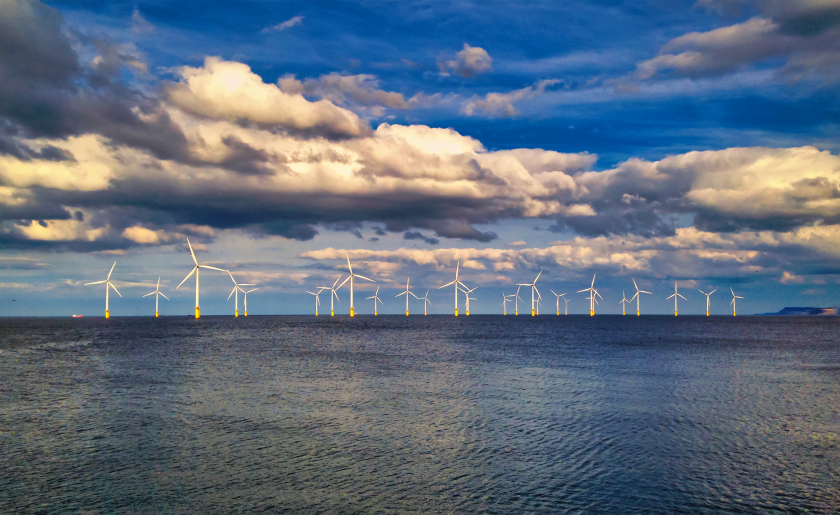 Offshore wind turbines off coast renewable energy esg.png