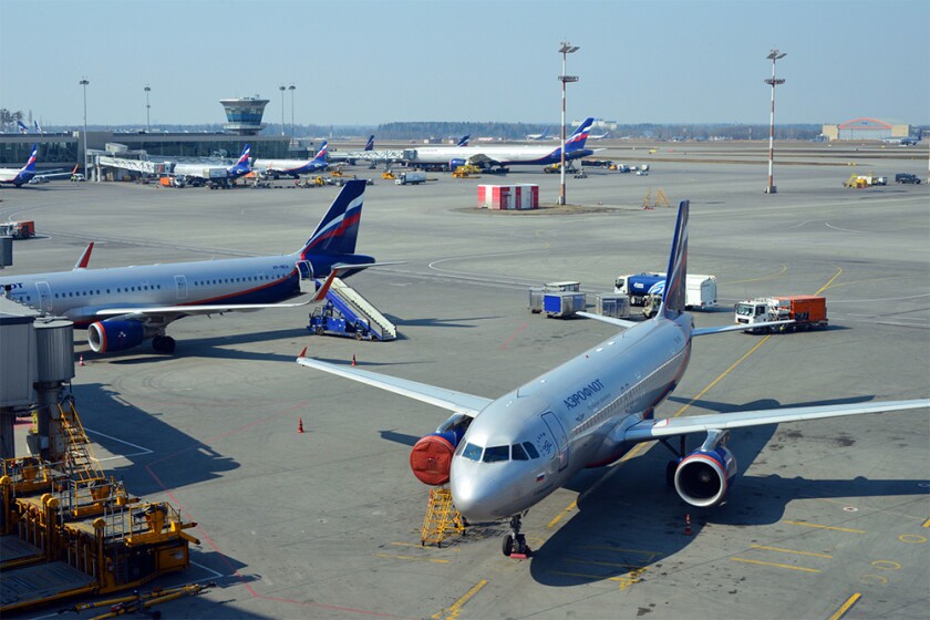 Moscow, Russia airport apron and leased Aeroflot Airbus A320-214 with an offshore registration from Bermuda.jpg