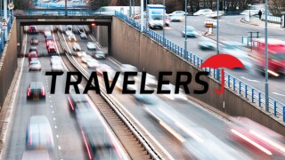 Travelers logo cars driving traffic highway.jpg