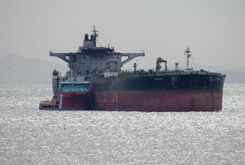 Piraeus, Greece, 17 March 2025. The Greek tanker "Sounio" is seen towed by two tugs in order to keep position in Piraeus anchorage. The tanker Sounion which drew worldwide attention in August 2024 after it was damaged by the Houthis in multiple attacks of