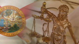 Figure Justice holding the scales of justice with lawyer working on documents