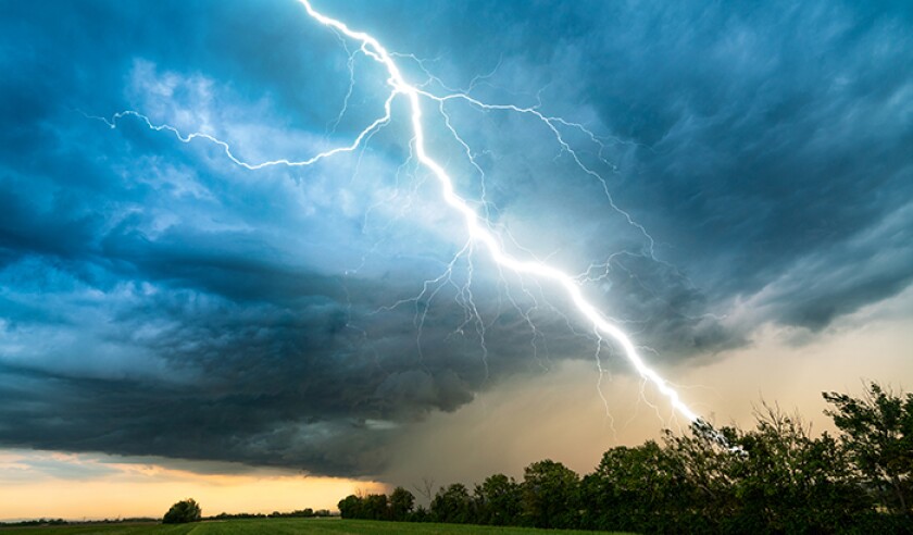 cloud storm sky with thunderbolt over rural landscape