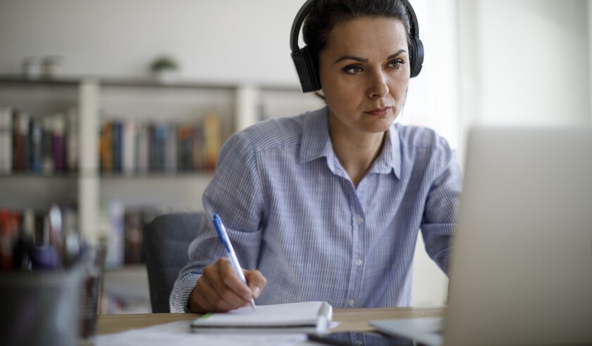 Mature woman working from home during COVID-19 pandemic
