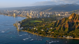 view of Diamond head mountain with modern city in background, Honolulu, Hawaii Islands, Oahu.png