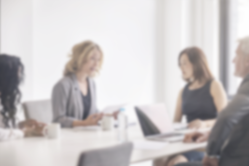 Business colleagues discussing in board room.png