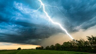 cloud storm sky with thunderbolt over rural landscape