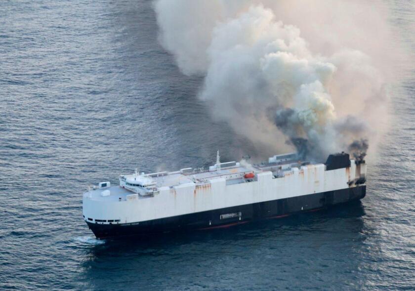 In this photo provided by the U.S. Coast Guard, smoke rises from cargo vessel Morning Midas approximately 300 miles south of Adak, Alaska, June 3, 2025, as the crew of a cargo ship carrying around 3,000 vehicles to Mexico, abandoned ship after they could